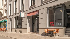 A building with a cafe named "Numa" on the ground floor. - Numa Munich St Paul (Munich)
