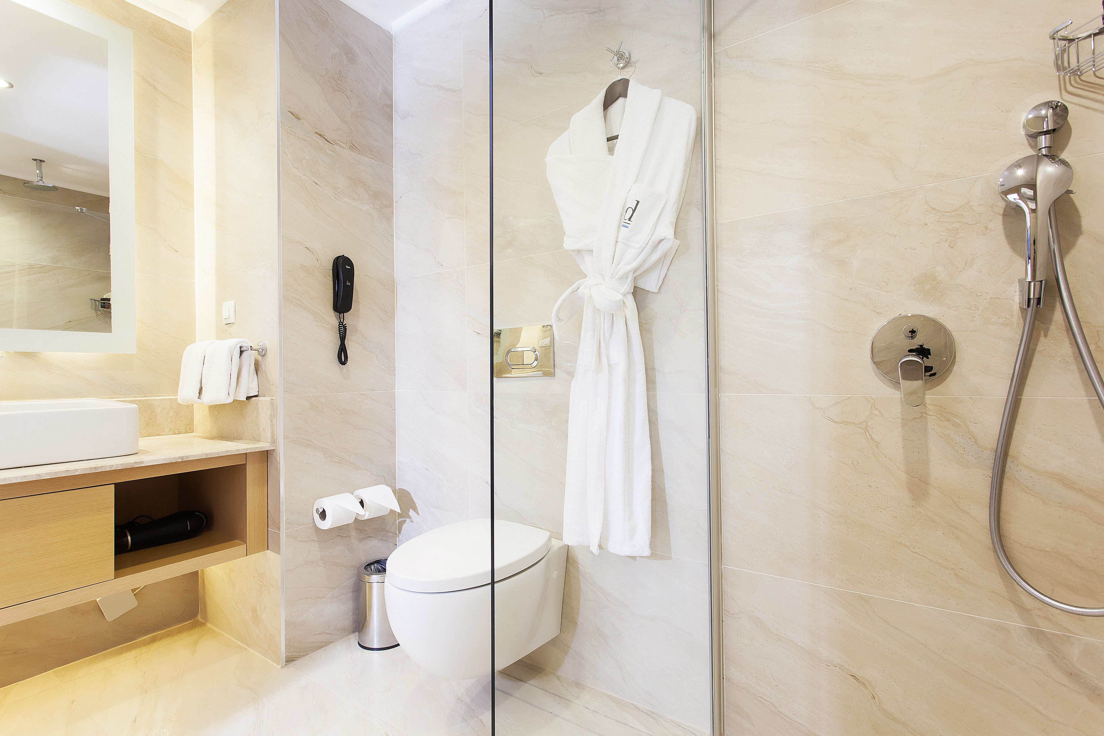 standard double room | bathroom | shower, rainfall showerhead, eco-friendly toiletries, hair dryer