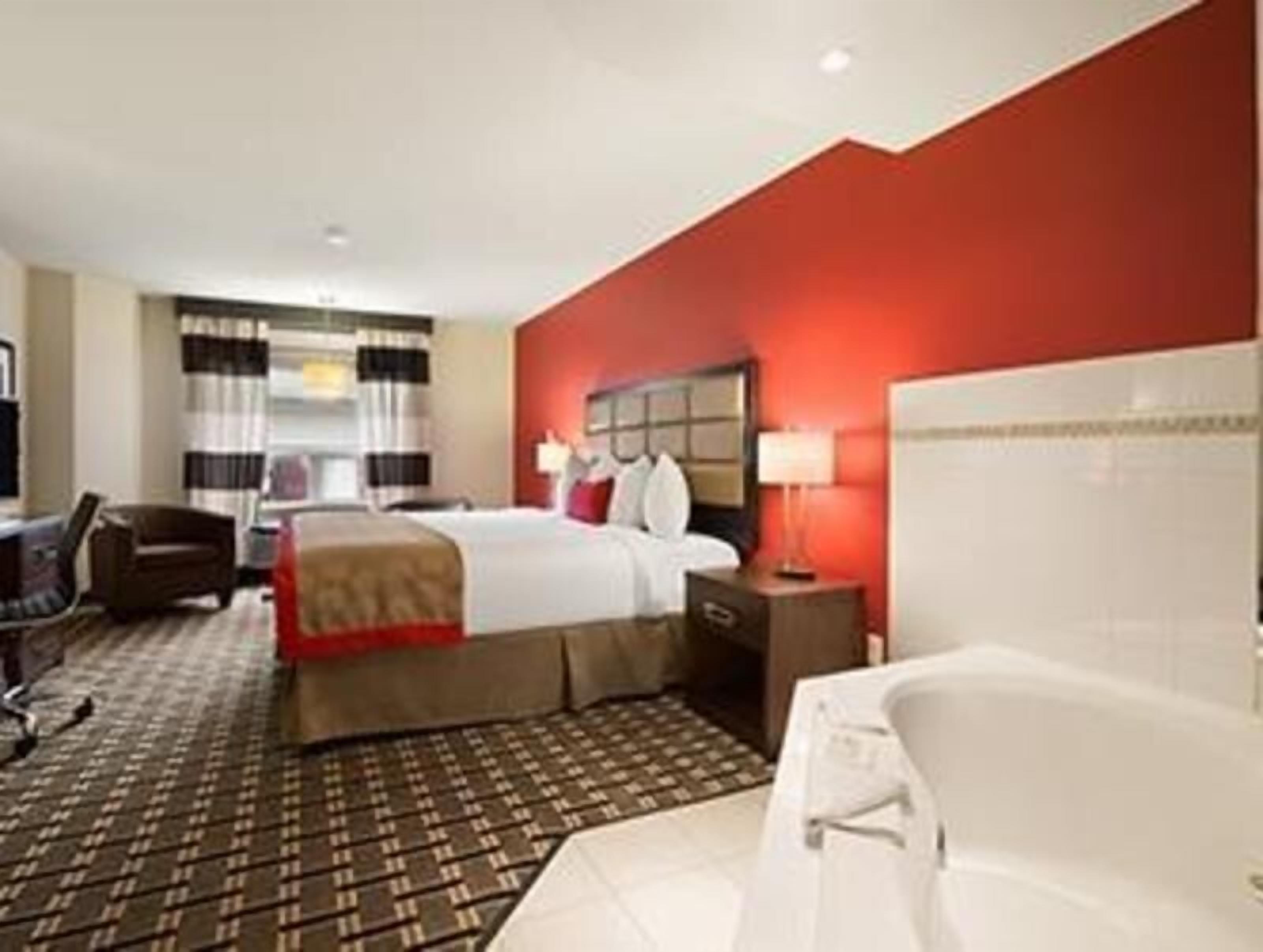 Desk, laptop workspace, blackout drapes, iron/ironing board