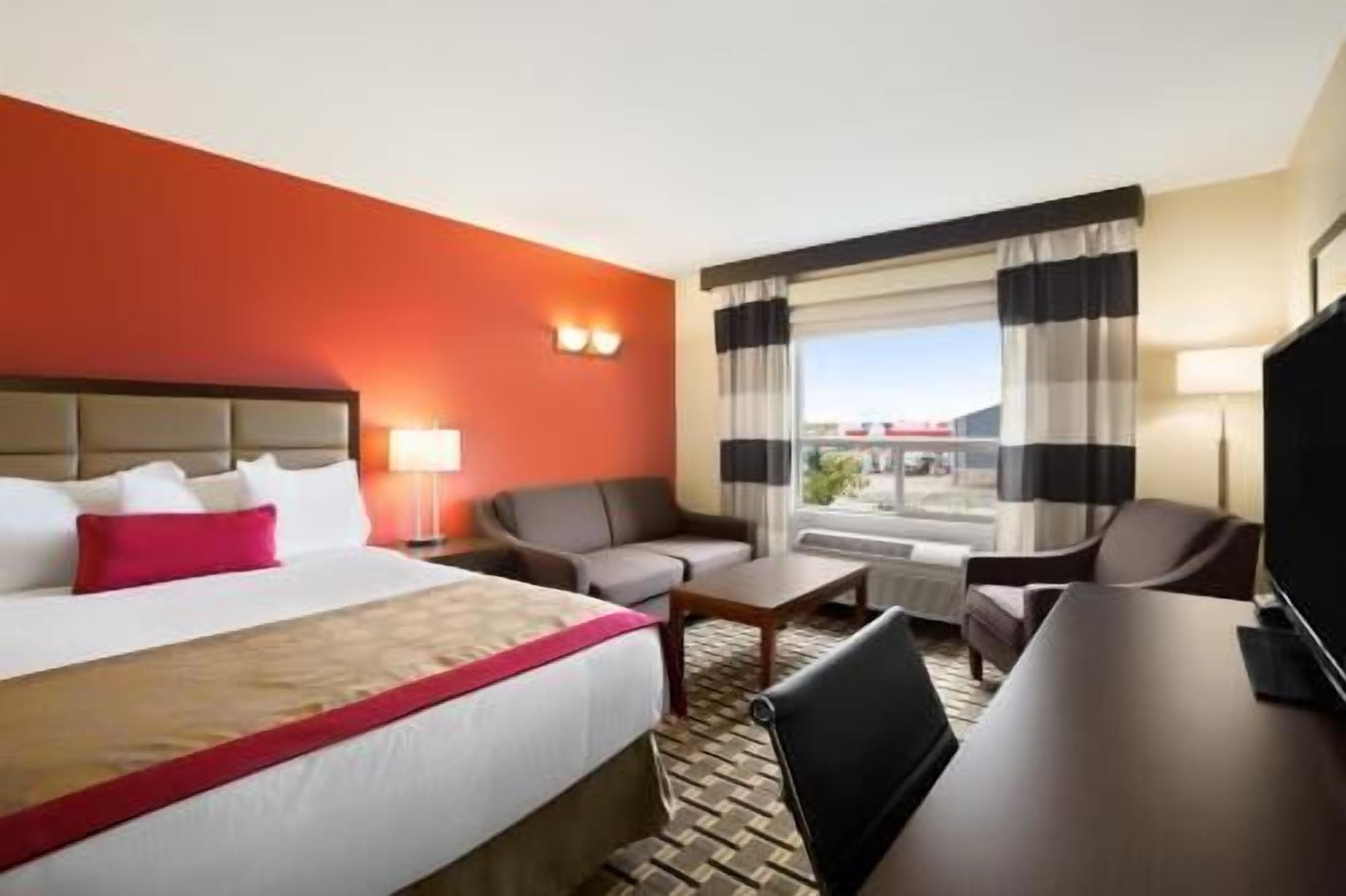 Desk, laptop workspace, blackout drapes, iron/ironing board