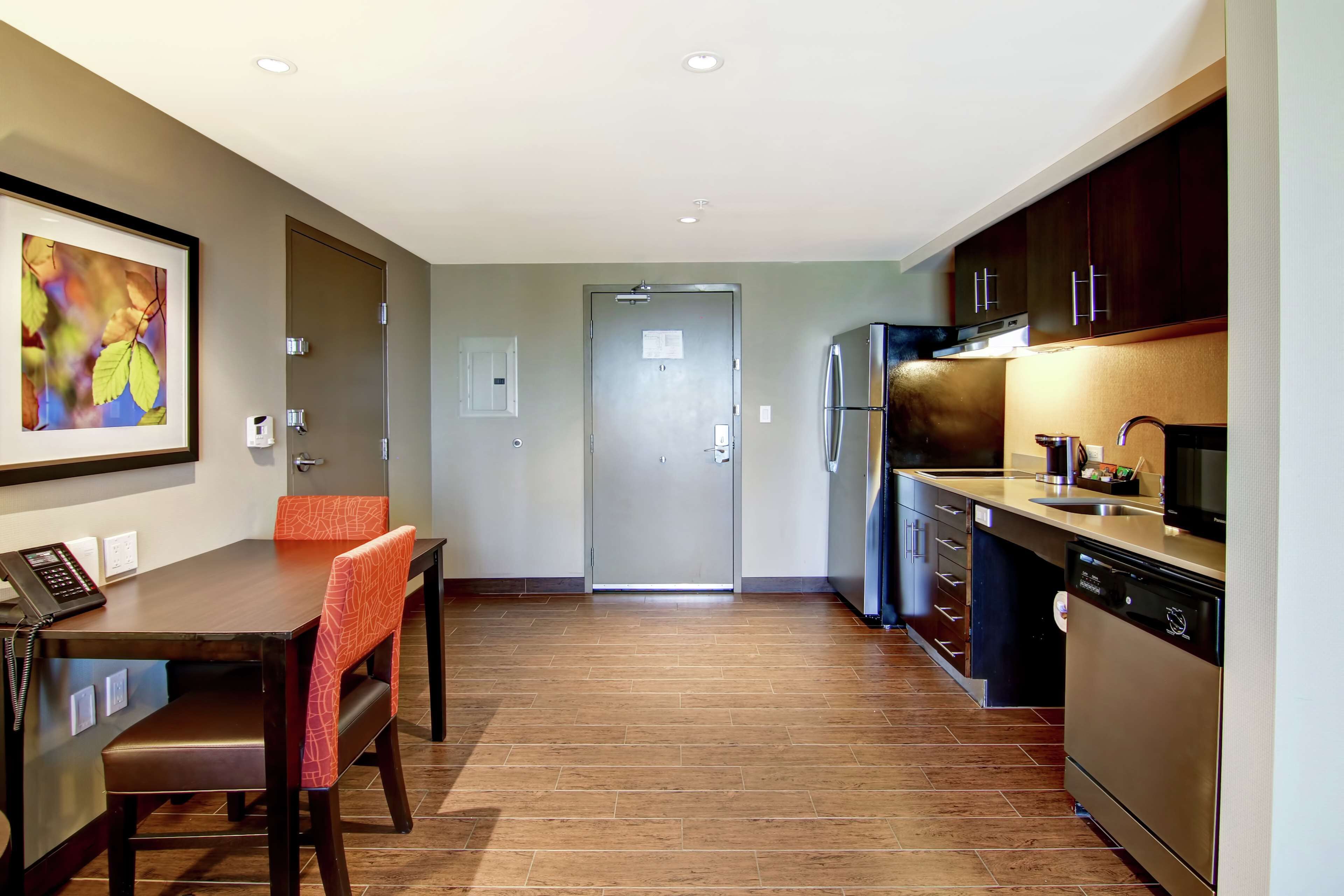 suite, 1 king bed, accessible (mobility & hearing, roll-in shower) | private kitchen | full-sized fridge, microwave, stovetop, dishwasher