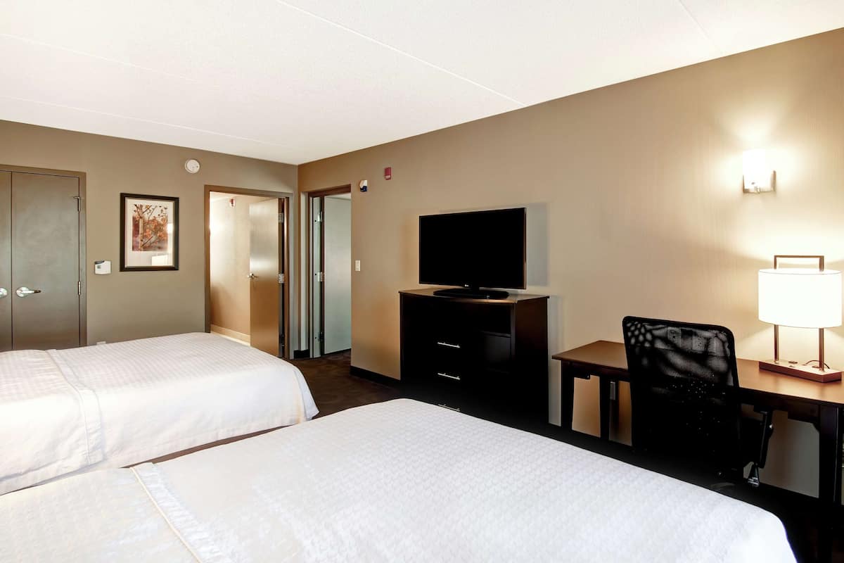 Suite, 2 Queen Beds, Accessible, Bathtub | Blackout drapes, free cribs/infant beds, free WiFi, bed sheets