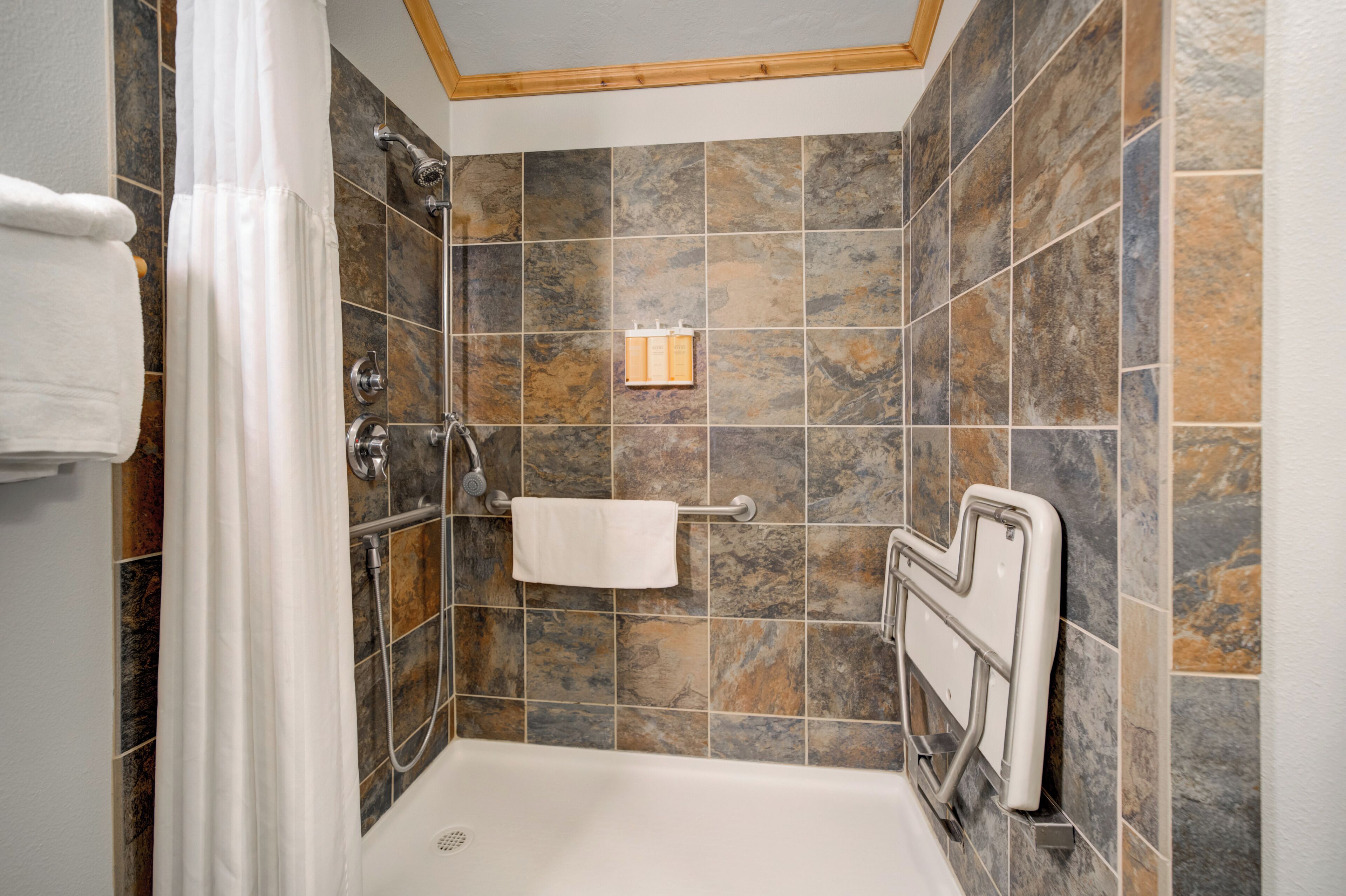 deluxe room, 1 king bed | bathroom | shower, hair dryer, bathrobes, towels