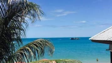 On the beach, sun-loungers, beach umbrellas