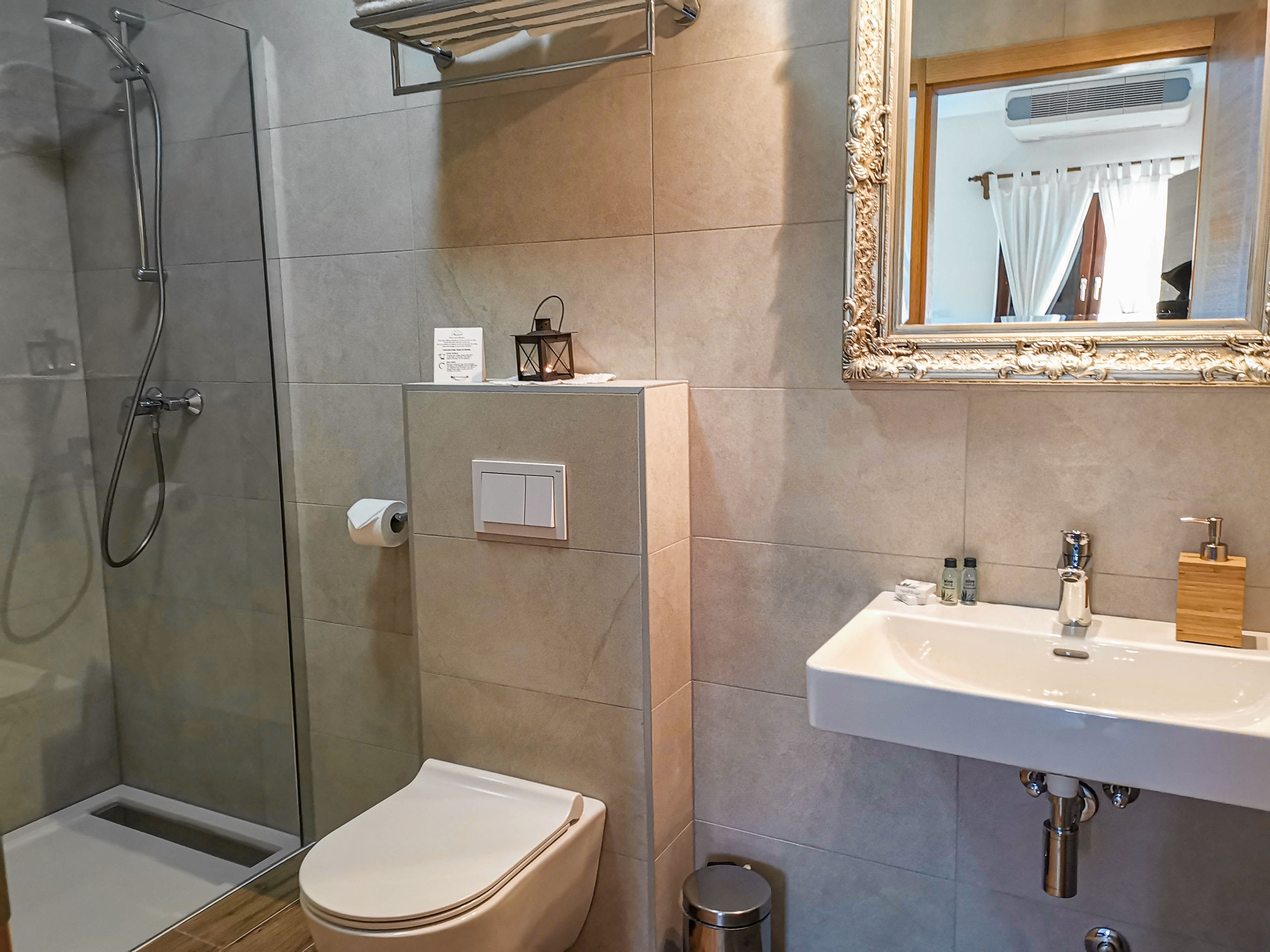 standard apartment | bathroom | shower, free toiletries, hair dryer, towels