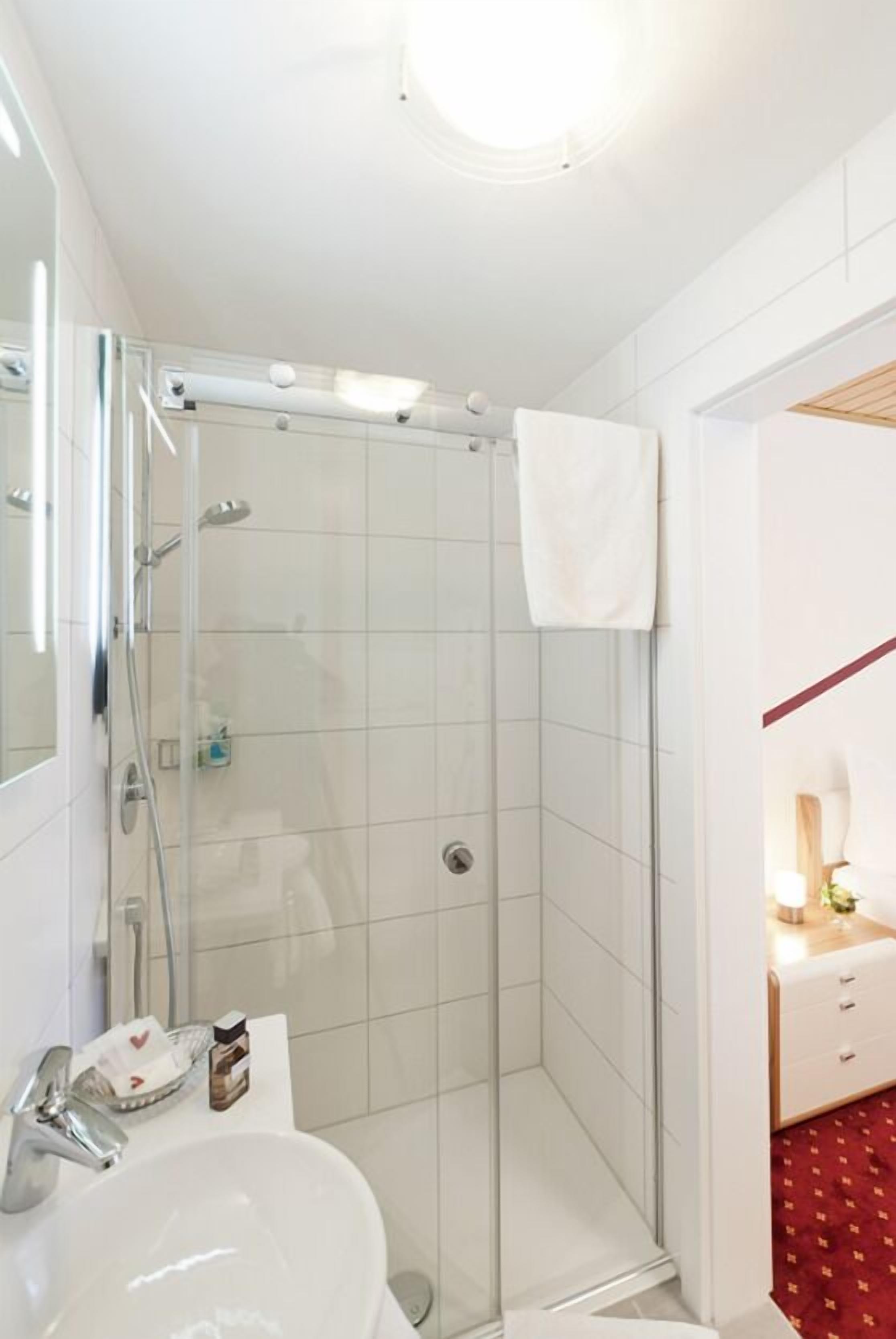 hair dryer, slippers, towels, soap