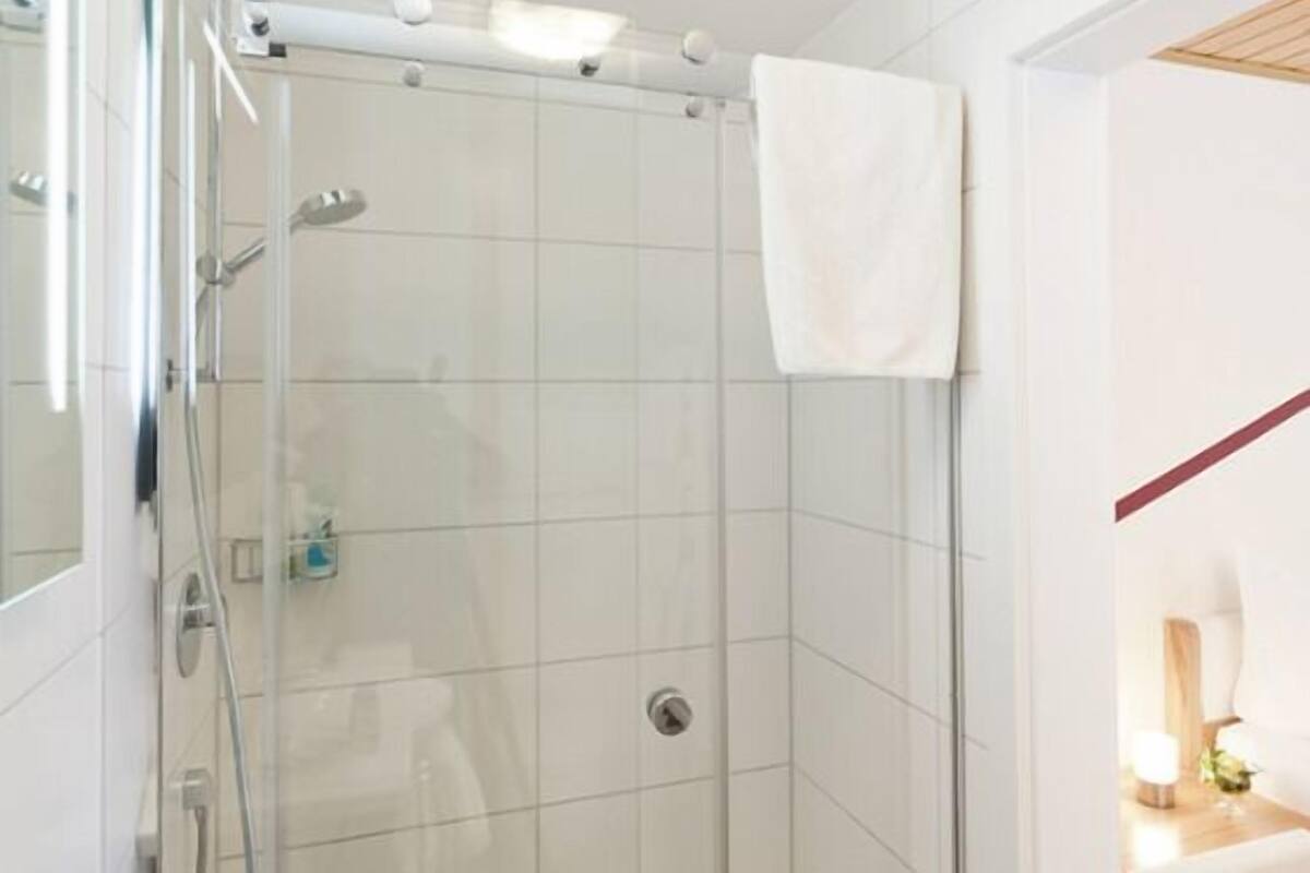 hair dryer, slippers, towels, soap