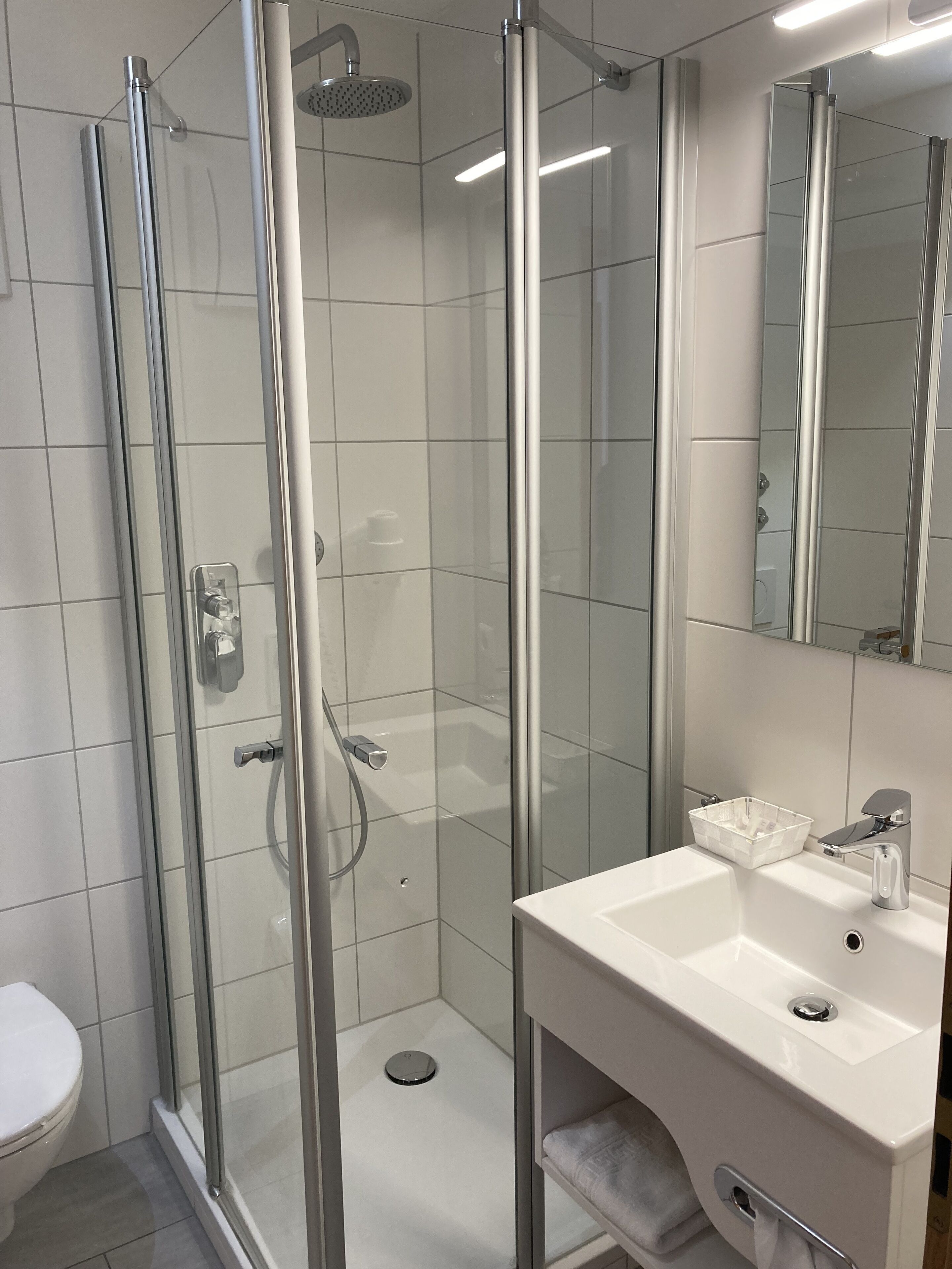 comfort single room | bathroom | hair dryer, slippers, towels, soap