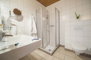 Apartment, 1 Double Bed | Bathroom | Shower, free toiletries, hair dryer, slippers