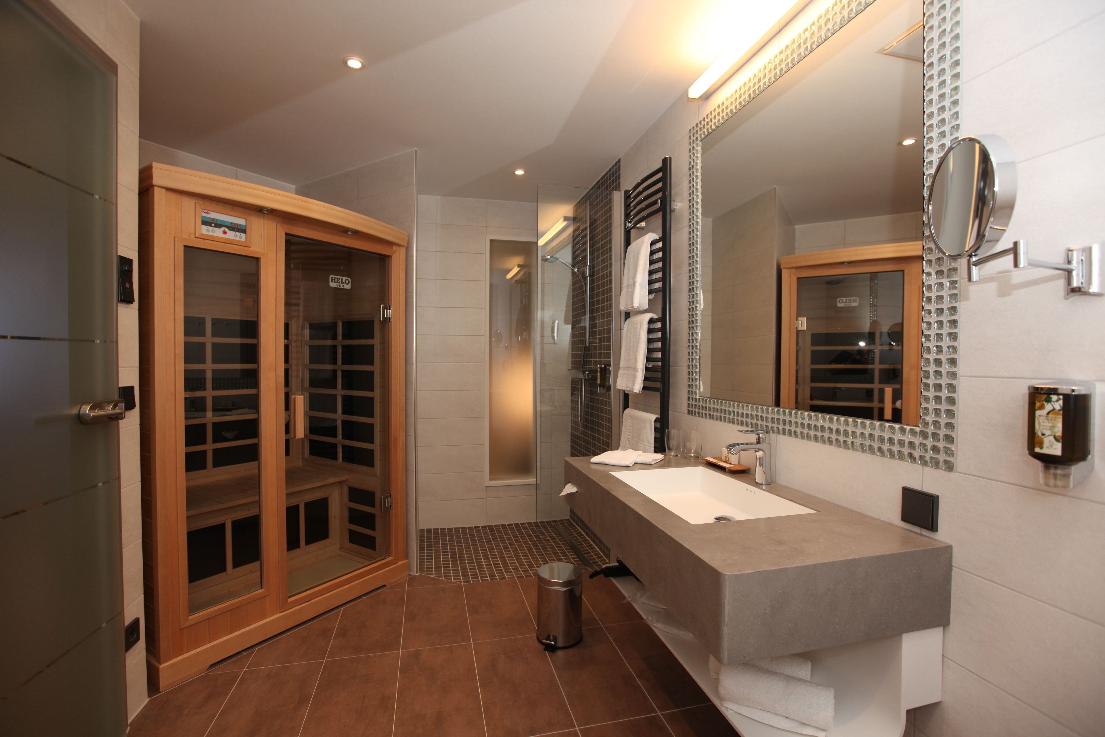 junior suite | bathroom | shower, slippers, towels