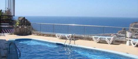 Outdoor pool, pool umbrellas, pool loungers