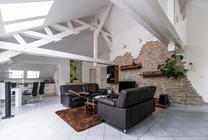 Waldpark Suite | Living area | Flat-screen TV