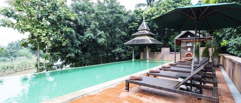 Outdoor pool, pool umbrellas, sun loungers