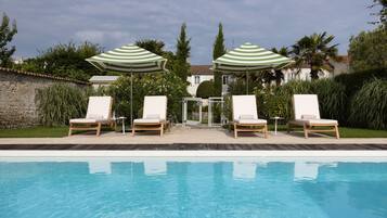 Seasonal outdoor pool, pool loungers