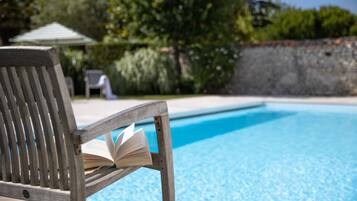 Seasonal outdoor pool, pool loungers