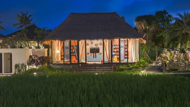 A thatched-roof building with a visible sign reading "aran junior". - Plataran Ubud Hotel & Spa (Ubud)