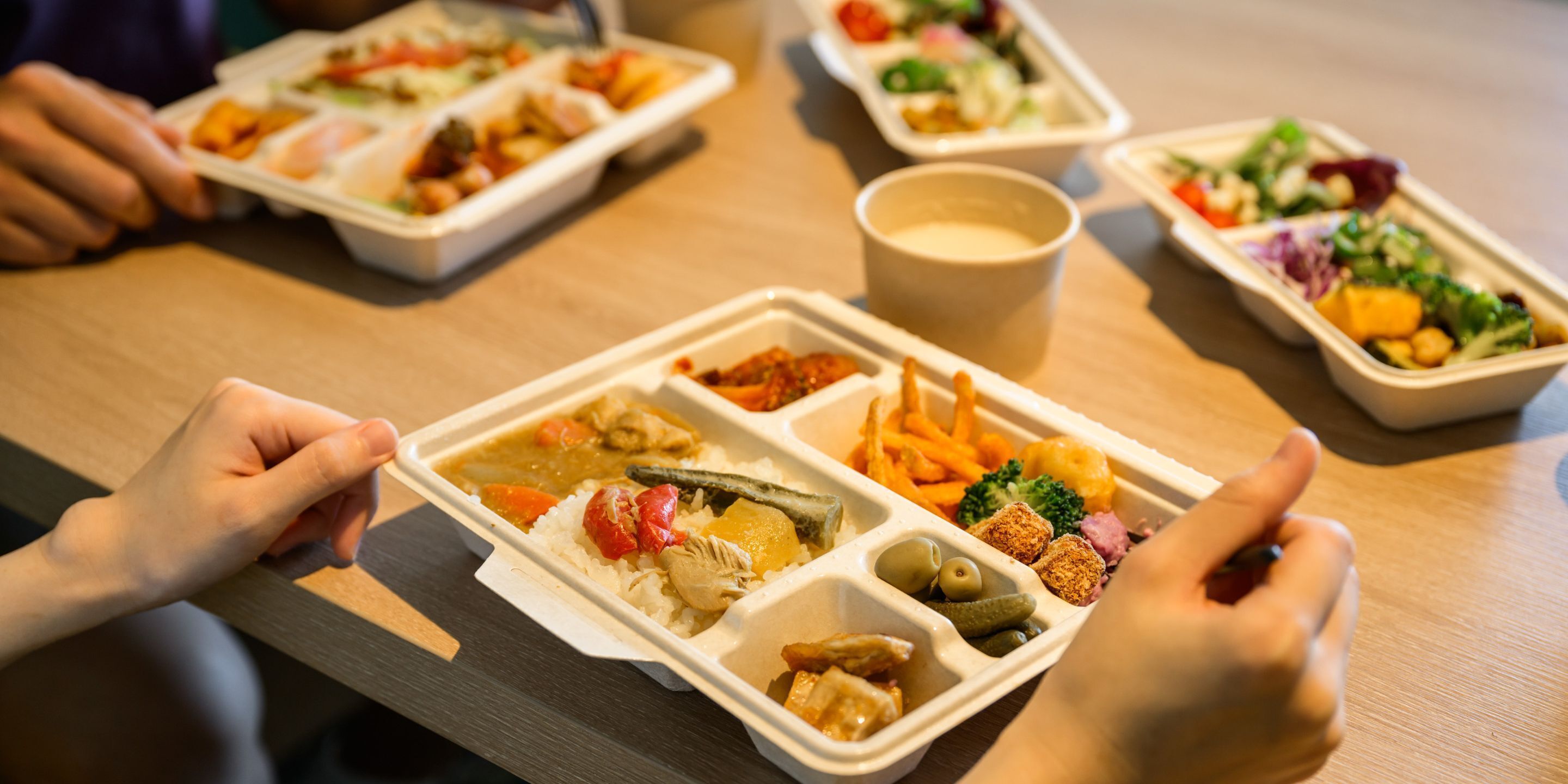 A table with multiple meal containers.