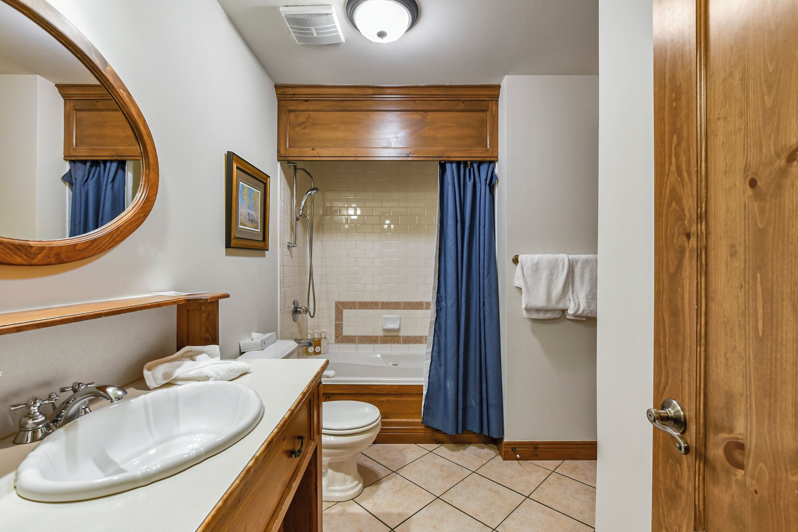A bathroom with a sink, toilet, bathtub, and shower.