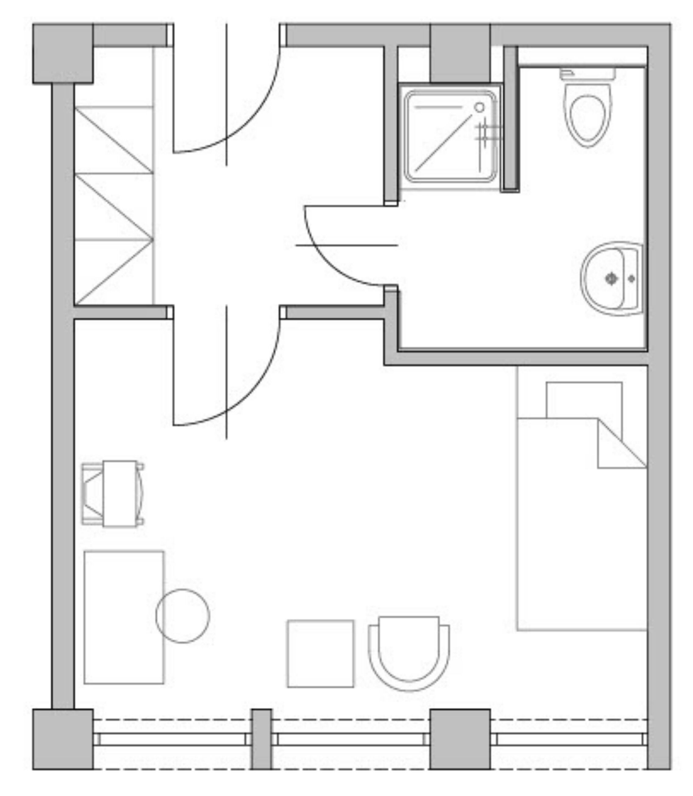 A floor plan of a hotel room with a bathroom, a kitchenette, a seating area, and a bed.