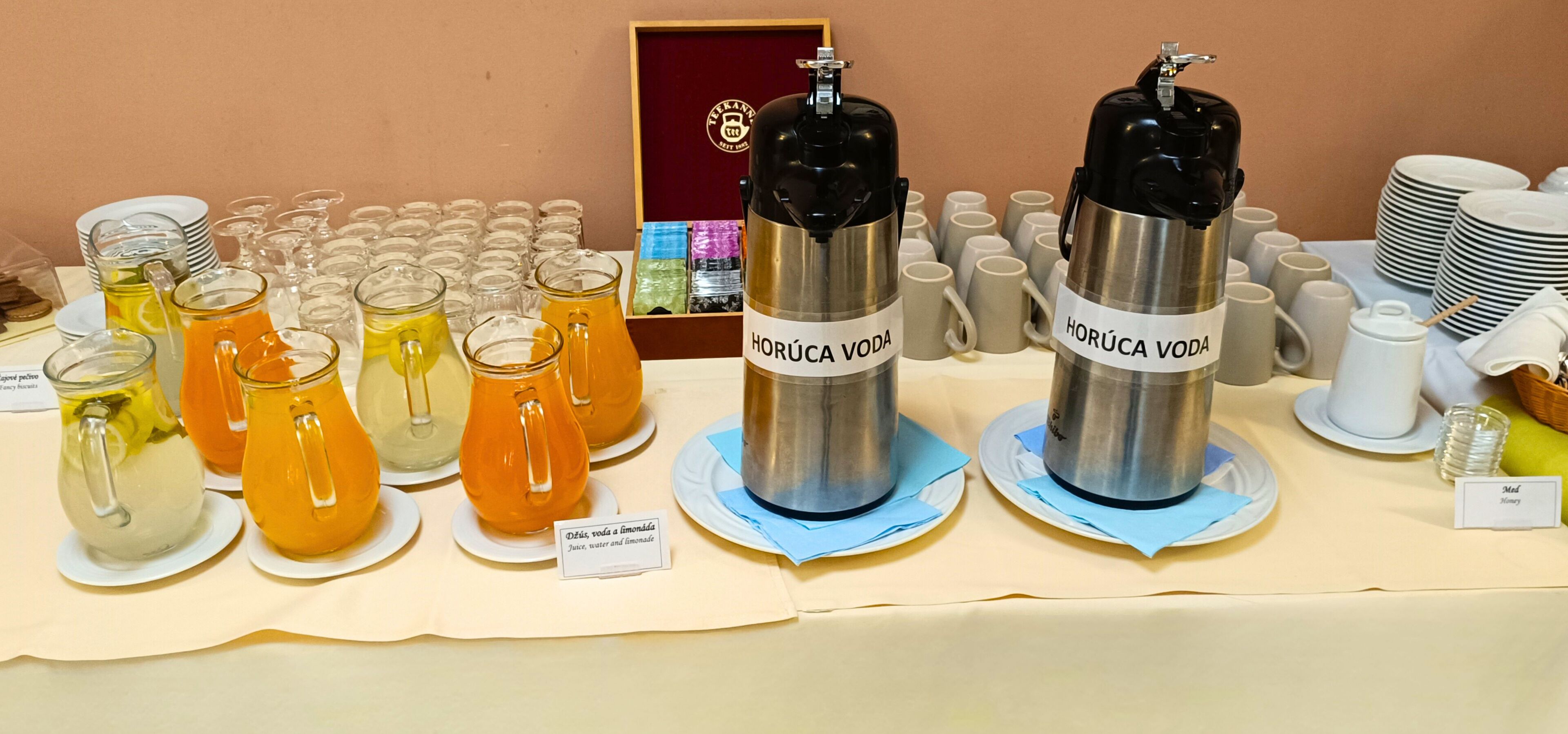 A beverage station with various drinks and a coffee machine.