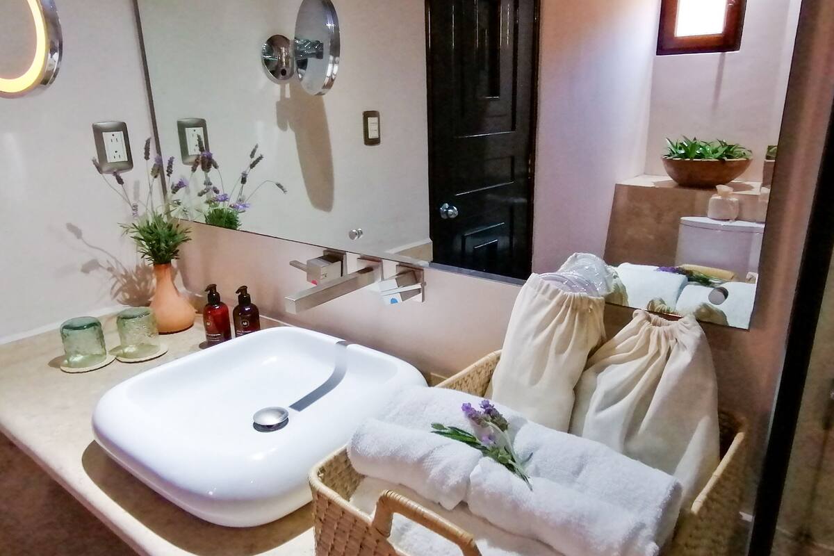 deluxe suite | bathroom | shower, designer toiletries, hair dryer, slippers