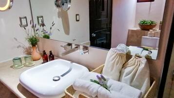 Deluxe Suite | Bathroom | Shower, designer toiletries, hair dryer, slippers