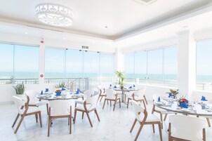 Breakfast, lunch, dinner served; international cuisine, pool views 