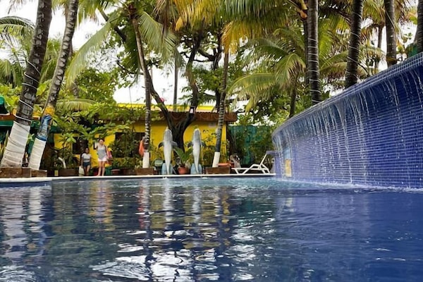 4 outdoor pools, open 8:00 AM to 10:00 PM, pool umbrellas, sun loungers