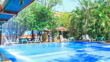 4 outdoor pools, open 8:00 AM to 10:00 PM, pool umbrellas, pool loungers