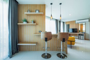 Junior Suite | Living area | 32-inch TV with satellite channels - The Par Phuket (Kathu)