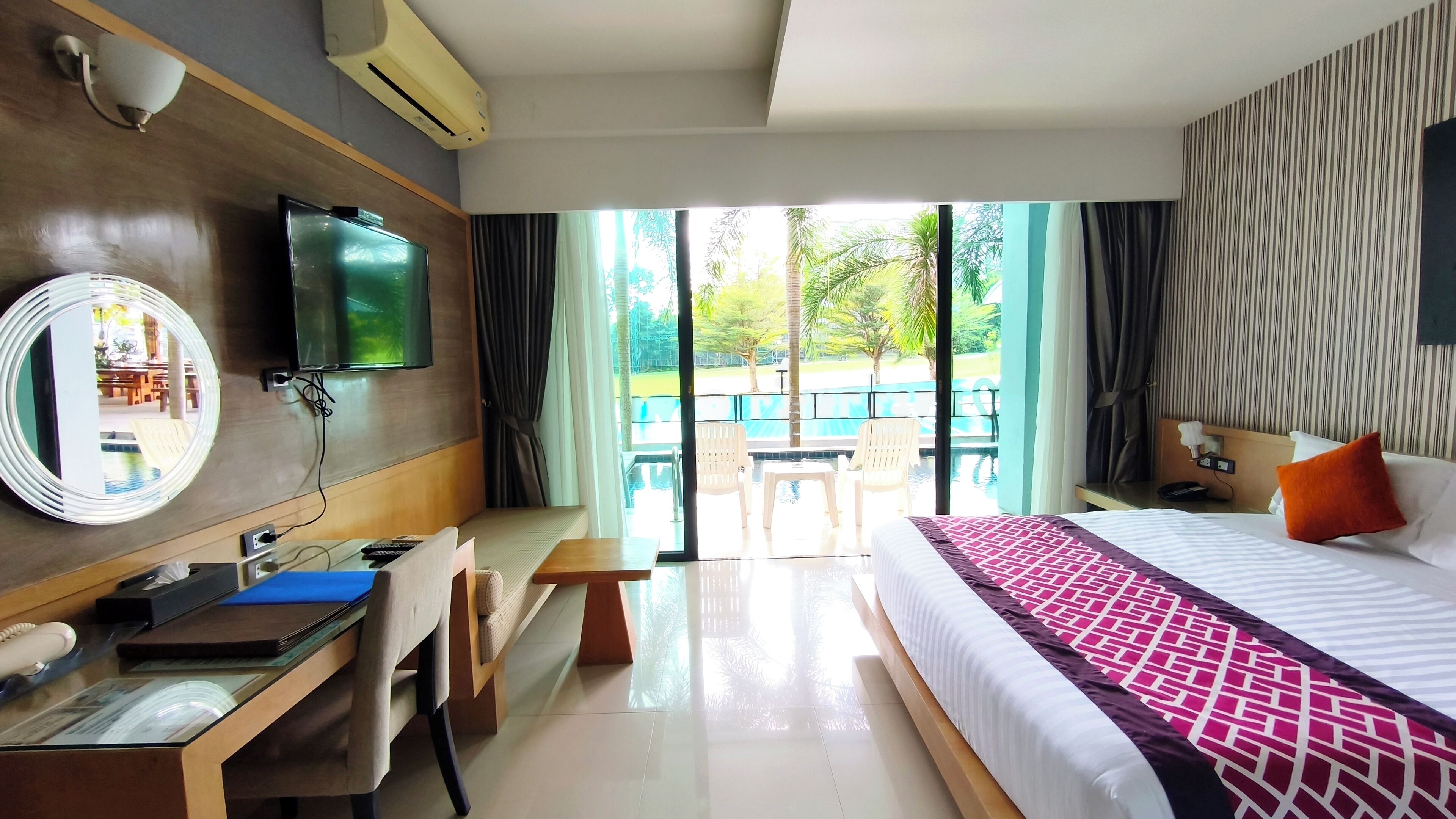 Deluxe Room, Pool Access | In-room safe, blackout drapes, free WiFi, bed sheets