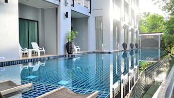 Outdoor pool, open 8:00 AM to 9:00 PM, pool loungers