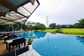 Outdoor pool, open 8:00 AM to 9:00 PM, pool loungers