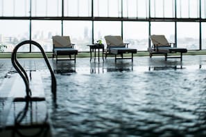 Indoor pool, pool umbrellas, sun loungers