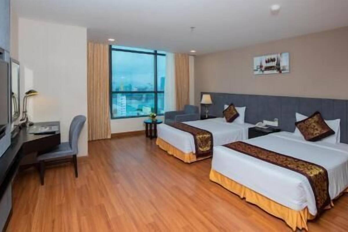 Camas con pillow-top, minibar y caja de seguridad en la habitación