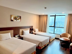 Deluxe Triple Room, City View | Pillowtop beds, minibar, in-room safe, individually furnished