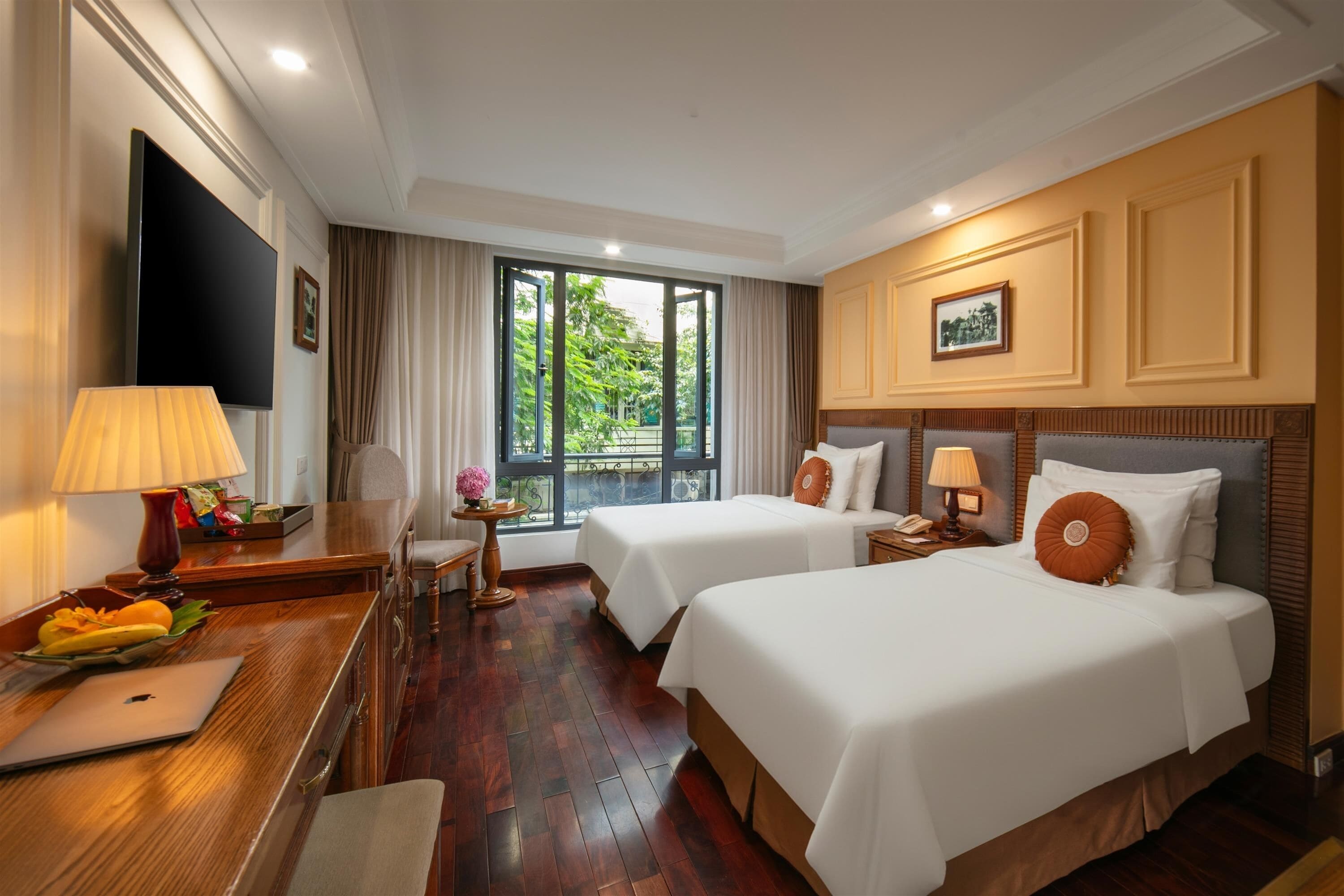 Deluxe Room, City View | Minibar, in-room safe, individually decorated, desk