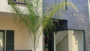 A building with a sign reading "Diggers Inn." - Digger Inn (Francistown)