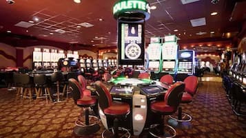 Experience the excitement of the casino floor, where roulette and gaming machines await.