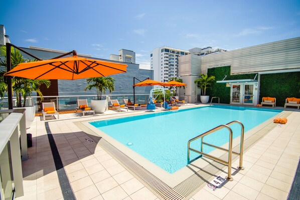 Outdoor pool, pool umbrellas, pool loungers