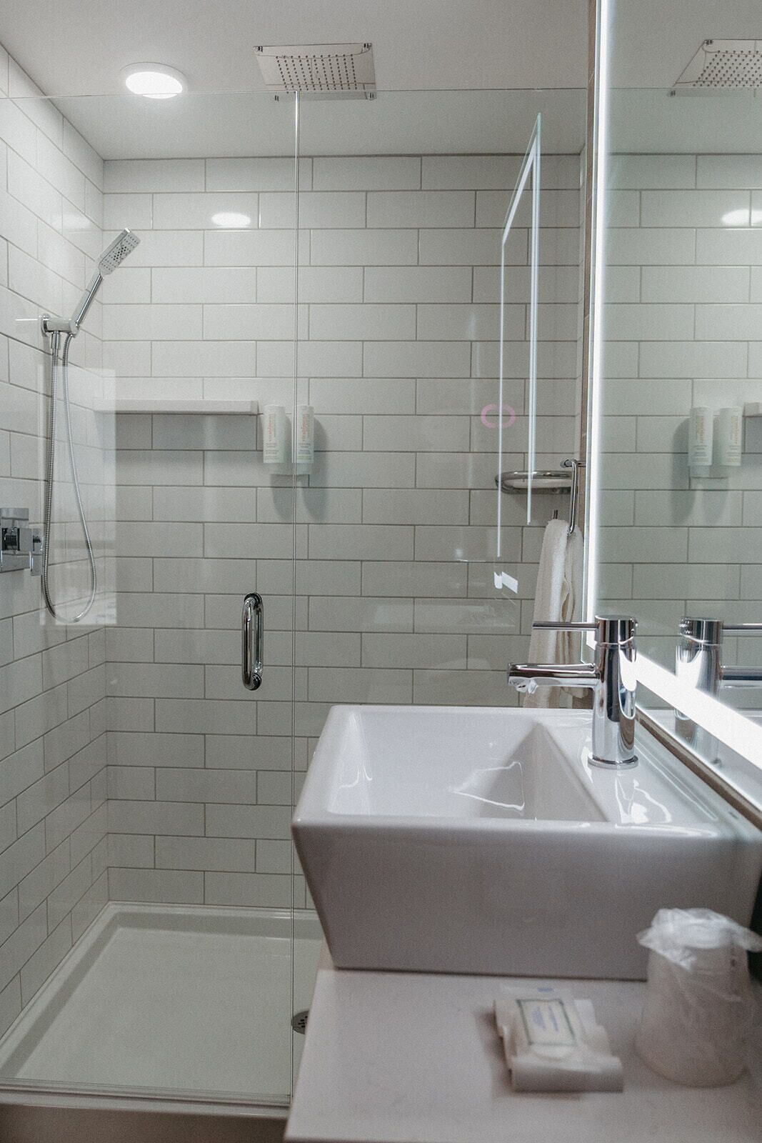 shower, rainfall showerhead, hair dryer, towels