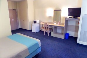 Desk, laptop workspace, bed sheets