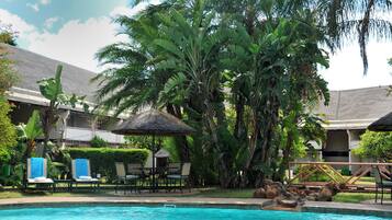 Outdoor pool, open 6:00 AM to 6:00 PM, pool umbrellas, pool loungers