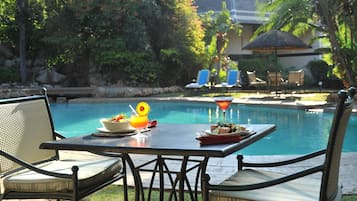 Outdoor pool, pool umbrellas, pool loungers