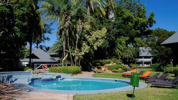 Outdoor pool, open 6:00 AM to 6:00 PM, pool umbrellas, sun loungers