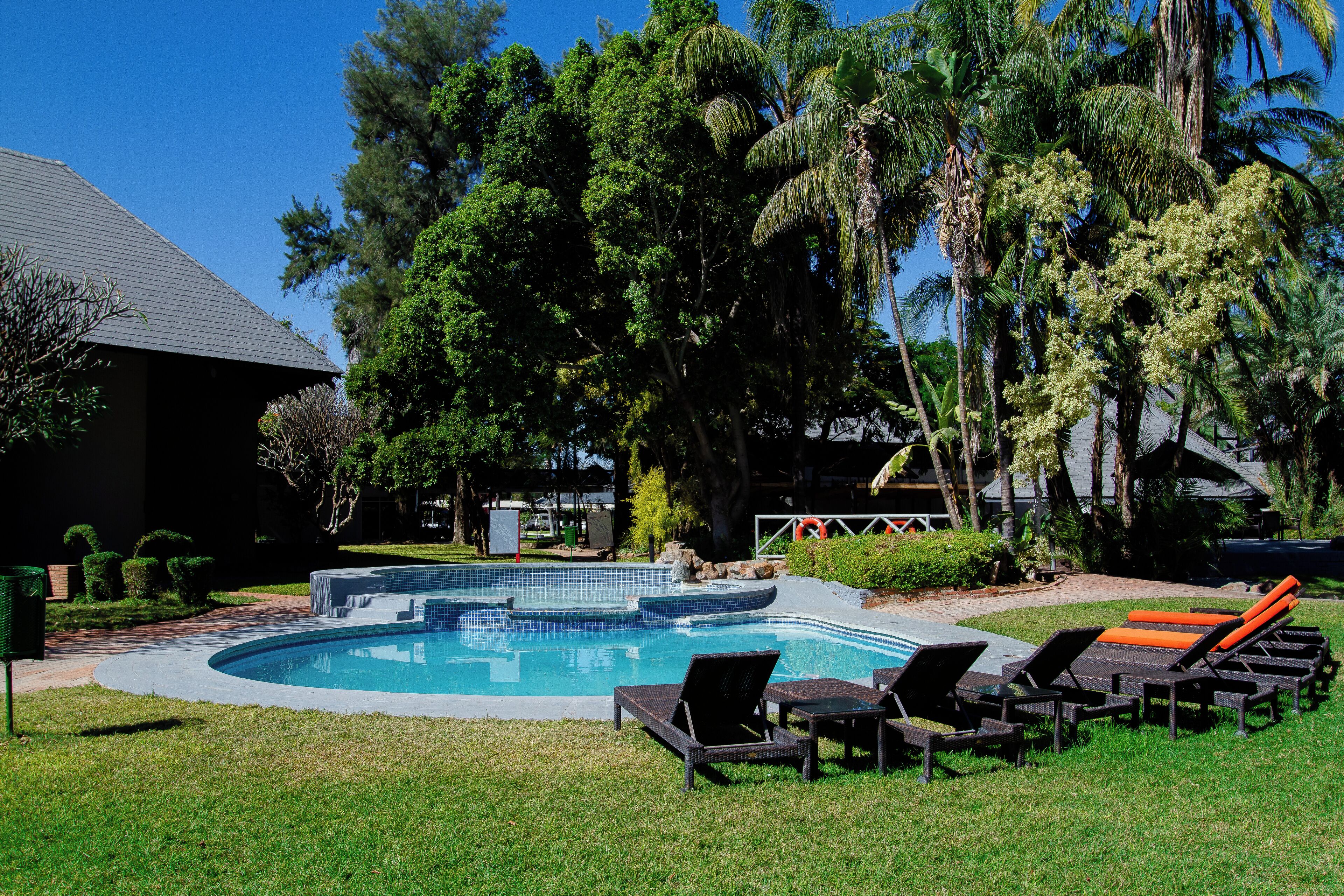 Outdoor pool, open 6:00 AM to 6:00 PM, pool umbrellas, pool loungers