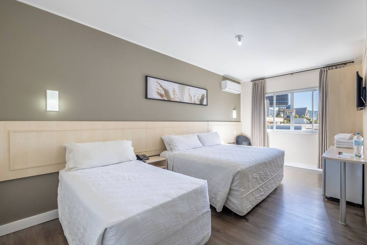 Triple Room, Mobility Accessible | Minibar, desk, laptop workspace, blackout drapes