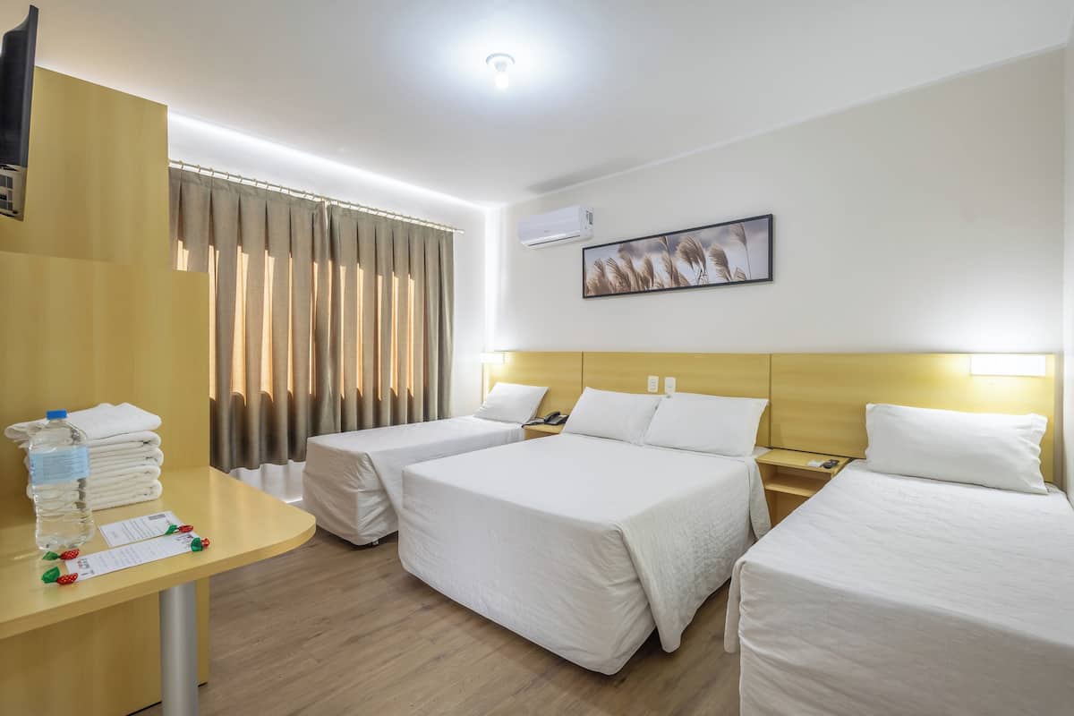 Quadruple Room | Minibar, desk, laptop workspace, blackout drapes