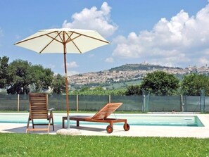 Seasonal outdoor pool, pool umbrellas, pool loungers