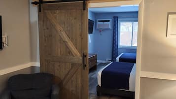 Standard Suite, 1 Bedroom | Living area | 32-inch LCD TV with digital channels, TV
